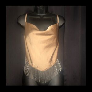 Spaghetti strap silky tank top with rhinestone trim. Size M